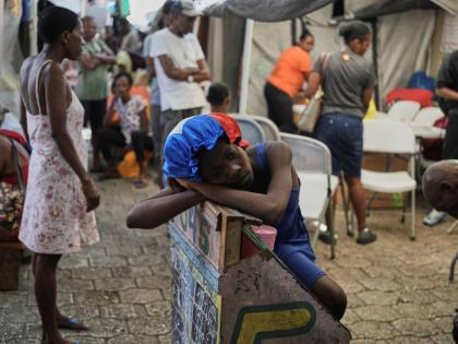 A girl rests at a shelter for families displaced by gang violence in Port-au-Prince, Haiti.