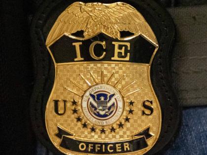 FILE - A federal agent wears an Immigration and Customs Enforcement badge in New York, June 10, 2025. (AP Photo/Yuki Iwamura, File)