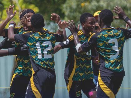Jamaica Under-14 players celebrate scoring against Aruba during their Caribbean Football Union (CFU) Challenger Series in the Dominican Republic yesterday. 