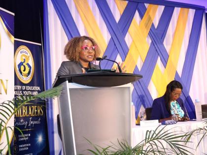 Minister of Education, Skills, Youth and Information, Senator Dr Dana Morris Dixon (at podium), addresses the ministry's Region Three Back-To-School Leadership Summit for Principals and School Board Chairs at Ocean Coral Spring Resort in Coral Spring, Trel