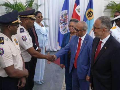 Haiti’s Prime Minister Alix Didier Fils-Aime (far right), Secretary-General of the Organization of American States (OAS), Albert Ramdin (second right), and CARICOM Secretary-General Carla Barnett greet senior police officials at the National Palace in Po
