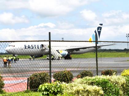 A plane carrying deportees from the United States arrives at the Roberts International Airport outside of Monrovia, Liberia, on Thursday. - AP photo