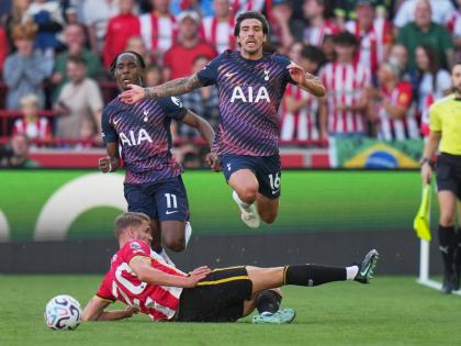 Brentford's Kristoffer Ajer, bottom, and Tottenham's Sandro Tonali in action during the English Premier League soccer match between Brentford and Tottenham Hotspur in London, Saturday, Aug. 22, 2026. (AP Photo/Kin Cheung)