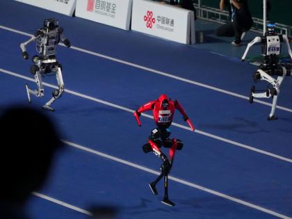 AP 
Robots compete in the 100-metre race during the opening ceremony of the World Humanoid Robot Games in Beijing, yesterday.