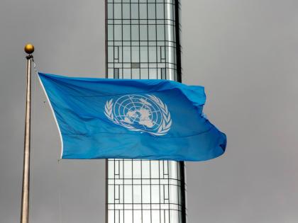 FILE - The UN flag flies on a stormy day at the United Nations during the United Nations General Assembly, Sept. 22, 2022. (AP Photo/Ted Shaffrey, File)