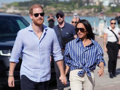 Prince Harry, and Meghan, the Duke and Duchess of Sussex, arrive for an event in Australia in April 2026.
