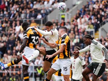AP 
Manchester United’s Matheus Cunha, (second right) heads the ball during the English Premier League football match against Hull City in Kingston upon Hull, England, yesterday. 