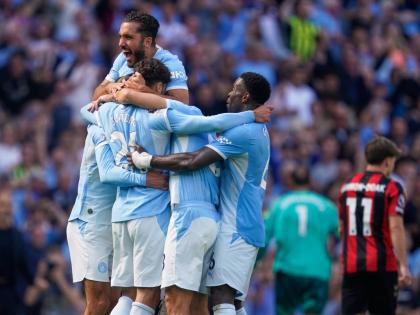 Manchester City's Josko Gvardiol (24) celebrates with teammates after scoring his side's second goal during the English Premier League soccer match between Manchester City and Bournemouth in Manchester, England, Sunday, Aug. 23, 2026. (AP Photo/Dave Thomps