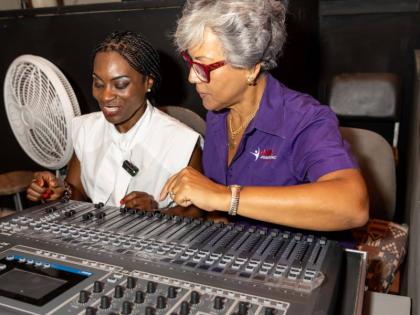Kim Mair (right), CEO of the JMMB Joan Duncan Foundation, takes a first-hand look at Little Theatre’s new Digital Sound Board System, with her is Marisa Benain, executive director of the Little Theatre. 