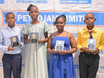Recipients of the Petrojam 2026 Primary Exit Profile (PEP) Scholarship (from left) Kenzo Riley and Denesha Watson of Greenwich Primary School and Joe-Lee Gordon and Neymar Price of St Andrew Primary School display their awards during the 20th anniversary P