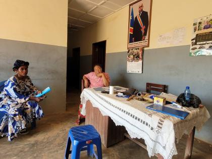 Parents who came for their children's school resumption sit inside an office of a school in Ituri province, eastern Congo, Thursday, Aug. 27, 2026. (AP Photo/Constant Same Bagalwa)