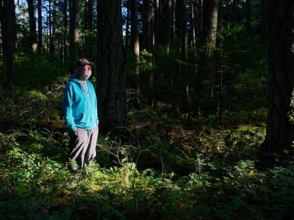 Andy MacKinnon, a forest ecologist, stands beneath the forest canopy near Victoria, British Columbia, Canada, Friday, May 29, 2026. 