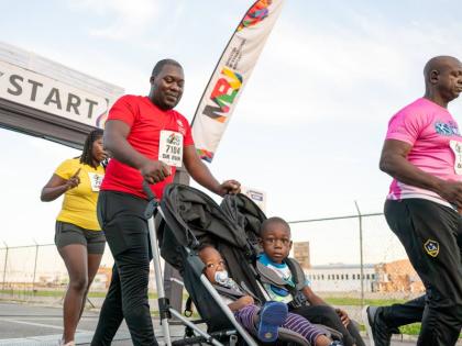 Babies can also join the fun at the MBJ Airports Foundation Charity 
Run/Walk event as this participant knows from the 2025 staging.