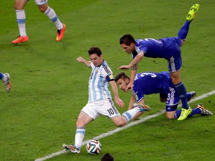 Argentina’s Lionel Messi scores his team’s second goal during the group F World Cup football match against Bosnia in Rio de Janeiro, Brazil, June 15, 2014. 