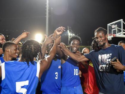 Kemar Dennis of the Majesty Gardens Legends celebrates a game winning three-pointer, with the team securing game one of three with a score of 68-66 against the Caribbean Basketball Academy at the GKONE Howard McCatty Community Basketball League at the stad
