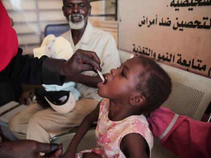 A Sudanese girl receives an oral cholera vaccine during a vaccination campaign conducted by health ministry workers in Khartoum, Sudan. - AP photo