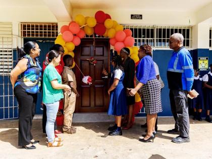 Representatives of the Digicel Foundation, Anchovy Primary School, the Ministry of Education, Skills, Youth and Information Region Four, and the Anchovy business community gather for the ribbon-cutting ceremony marking the reopening of the school’s smart