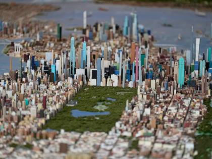 Central Park and the tall buildings of midtown Manhattan are seen on a large model of the New York City, made by Joe Macken, at the Museum of the City of New York in New York.