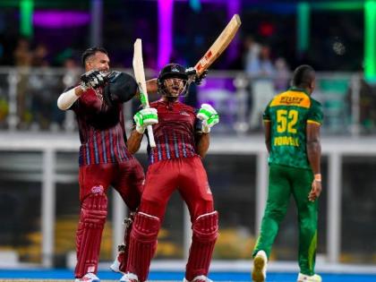The Antigua and Barbuda Falcons batsmen celebrate their team's victory over the Jamaica Kingsmen at the end of the Caribbean Premier League final at Kensington Oval in Barbados on Sunday night.