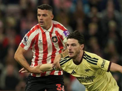 Sunderland’s Granit Xhaka, left, and Arsenal’s Declan Rice challenge for the ball during the English Premier League soccer match between Sunderland and Arsenal in Sunderland, England, Saturday, September 12, 2026. 