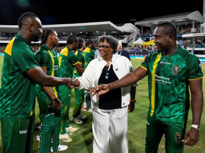 Barbados Primee Minister Mia Mottley (centre) is introduced to Jamaica Kingsmen all-rounder Andre Russell (left) by the team’s captain, Rovman Powell ahead of the start of the Republic Bank Caribbean Premier League final against the Antigua and Barbuda F