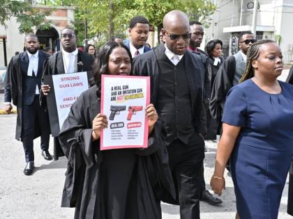 Lawyers stage silent protest at the Supreme Court Complex in Kingston and the Western Regional Gun Court on Wednesday over provisions of Jamaica’s Firearms Act. – Rudolph Brown photo
