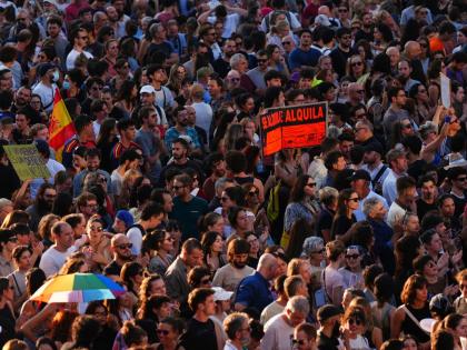 People gather during a protest following the eviction last Wednesday of 87-year-old Maricarmen to demand stronger laws to protect renters at Puerta del Sol in Madrid, Spain on Saturday.