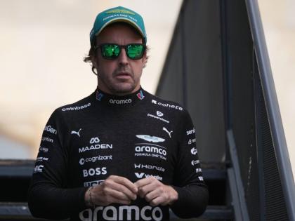 Aston Martin driver Fernando Alonso of Spain walks through the paddock prior to the qualifying session for the Azerbaijan F1 Grand Prix, in Baku, Azerbaijan, on Friday.