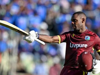 West Indies batsman Justin Greaves celebrates scoring his maiden Test century, in the opening cricket match of the One Day International Series on Sunday, September 27, 2026.