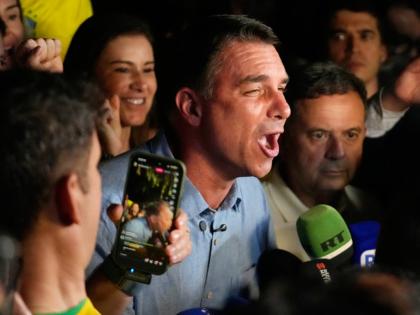 Opposition presidential candidate Senator Flavio Bolsonaro speaks after advancing to a runoff election following the first round of the presidential election in Brasilia, Brazil, Sunday.