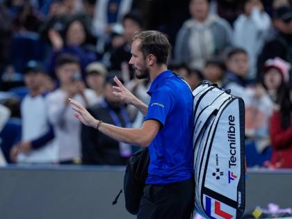 Daniil Medvedev, of Russia, leaves the court after being disqualified during a semi-final match against Novak Djokovic, of Serbia at the China Open tennis tournament in Beijing, yesterday.