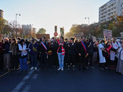 Students gather on the street before a demonstration against under-resourced schools, in Paris, Tuesday, Oct. 6, 2026. (AP Photo/Aurelien Morissard)