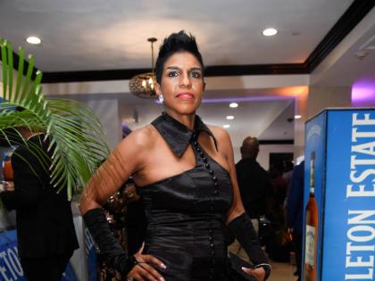 Audrey McIntosh, head of private banking at NCB, accentuates her floor-length mermaid dress by Sophia Jones with matching gloves.
