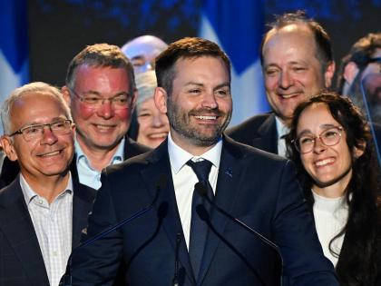 Parti Quebecois Leader Paul St-Pierre Plamondon (centre) speaks to supporters after winning the provincial election in Montreal, Quebec on Monday.