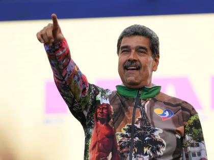 FILE - Former Venezuelan President Nicolas Maduro points to supporters during a campaign rally in the Catia neighbourhood of Caracas, Venezuela, July 18, 2024. (AP Photo/Matias Delacroix, File)