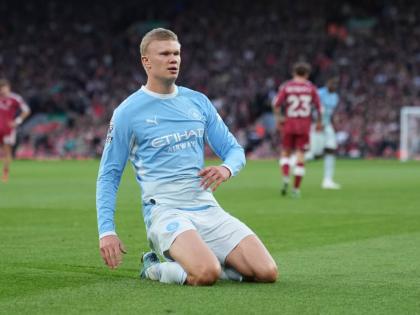 Manchester City’s Erling Haaland celebrates after scoring his side’s opening goal during the English Premier League match between Liverpool and Manchester City in Liverpool, England yesterday.