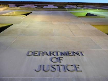 FILE - Tthe Department of Justice headquarters building in Washington is photographed early in the morning, May 14, 2013. (AP Photo/J. David Ake, File)