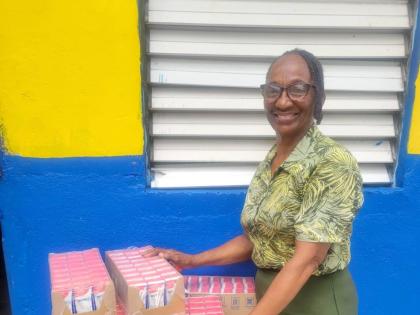 Mildred Myers Isaacs, teacher at Galilee Early Childhood Development Centre in Kingston, proudly showcases the first delivery of Nutri+ Milk. The school is set to receive 2,400 units of milk throughout the 2026/2027 academic year.