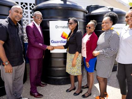 Guardian Life Limited donated three 1,000-gallon water tanks to Mico Practising Primary and Junior High School, under its Water Tank Initiative programme. The handover was attended by (from left) Member of Parliament for Southeastern St Andrew, Julian Robi
