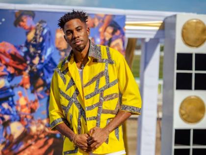 Djavan Warner pops in a bright yellow twill and spandex piece, accentuated by snakeskin. 