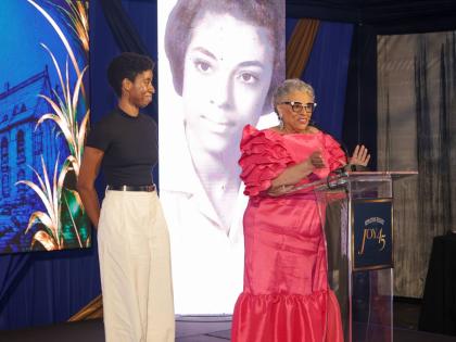 Cara Fraser (left) looks on as Appleton Estate Master Blender Dr Joy Spence speaks about the inspiration behind the Joy Spence Appleton Estate Scholarship in Chemistry and its role in creating opportunities for aspiring chemists during Joy45, a celebration