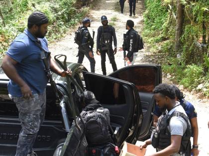 Members of the Jamaica Constabulary Force (JCF), are seen in Five Miles in Sligoville, St. Catherine.