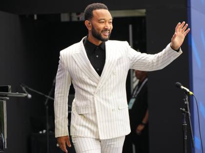 John Legend says he remains committed to challenging himself and making every album his best.