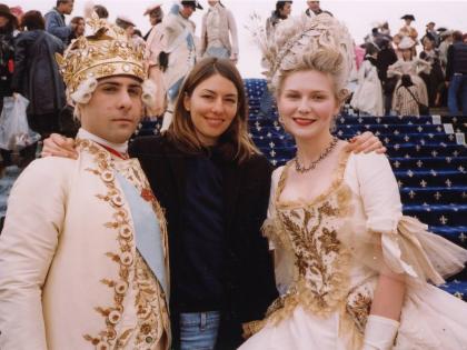 This image released by MUBI shows Sofia Coppola (centre) with cast members Jason Schwartzman (left) and Kirsten Dunst on the set of ‘Marie Antoinette’.