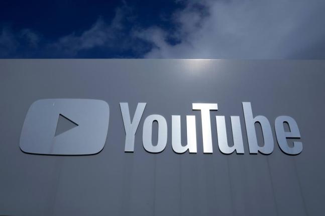 A YouTube sign is shown near the company's headquarters in San Bruno, California, Wednesday, March 12, 2025. (AP Photo/Jeff Chiu, file)