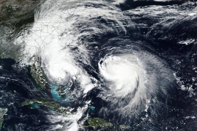 This Monday, September 29, 2025, satellite image released by NASA shows Imelda, left, and Hurricane Humberto in the Atlantic Ocean. (NASA Worldview, Earth Observing System Data and Information System (EOSDIS) via AP)