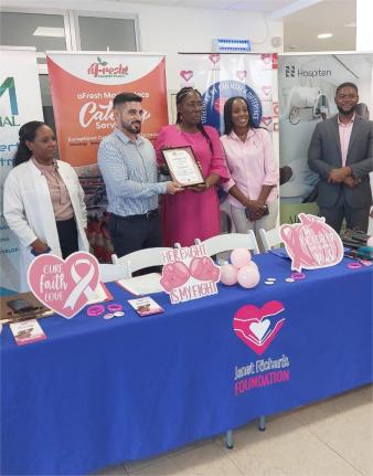 Janet Richards (centre), founder of the Janet Richards Foundation charity organisation, presents a certificate of appreciation to Samuel Afonso Diaz (second left), country manager for the Hospiten medical facility in Montego Bay, St James, during the launc