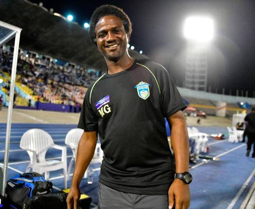 St George’s College assistant coach, Marcel Gayle, is pleased with team’s performance against St Jago at Winchester Park yesterday. St George’s College won 3-1.