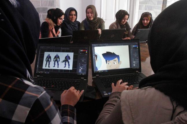 
In this January 22, 2018 photo, Afghan coders practise at the Code to Inspire computer training centre in Herat province, western Afghanistan.