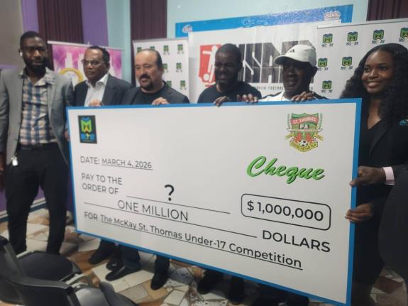 Jason McKay, chief executive officer, McKay Security Limited (centre) is joined by representatives of the St Thomas FA (from left), Moxon Walker, manager, Heartease United; Lascelles Logan, president, St Thomas FA; Whitehorses' manager, Noel Archibald; Alf